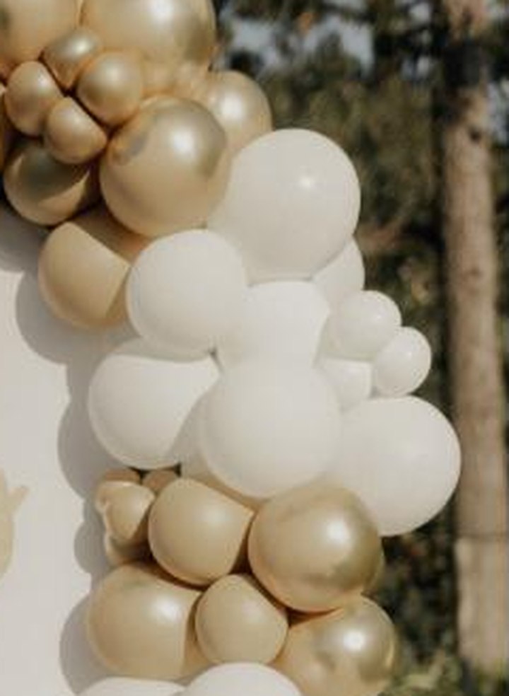 Black and gold happy birthday banner with silver balloons